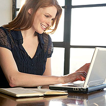 image of woman typing on laptop key board